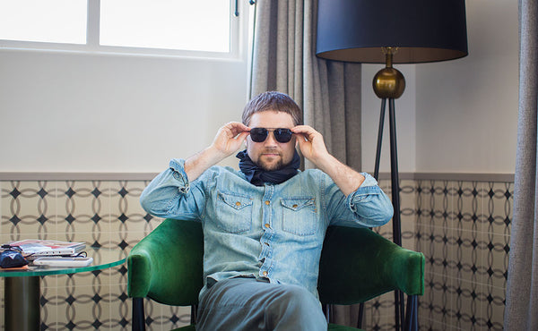 A person wearing the Shepherd's Wool Utility Cloth as a kerchief.